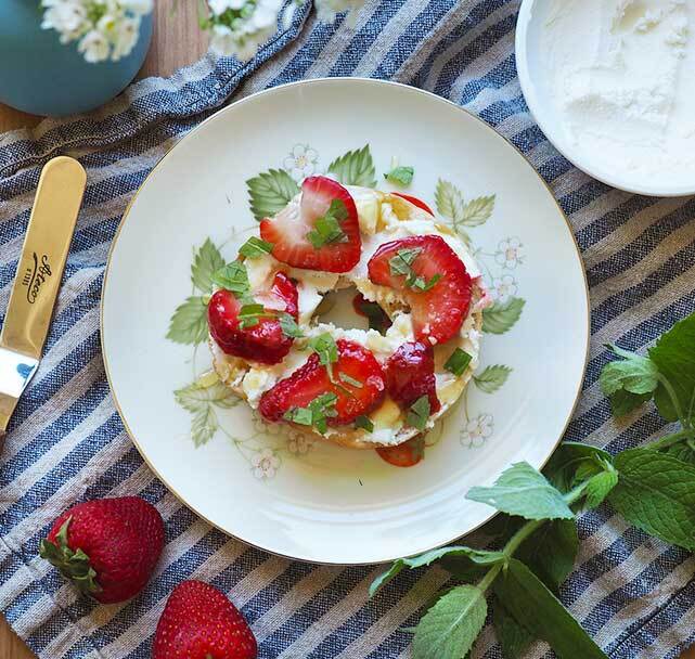 Spreadable goat cheese strawberry bagel